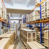 Logistic and distribution warehouse. Empty warehouse full of cargo. Cardboard boxes. Rows of shelves with paper boxes. Commercion concept